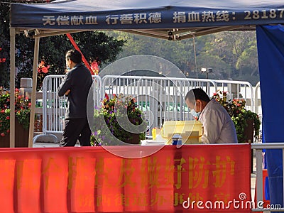 During the prevention and control of Wuhan pneumonia, a medical staff at a blood donation station was holding his post. Editorial Stock Photo