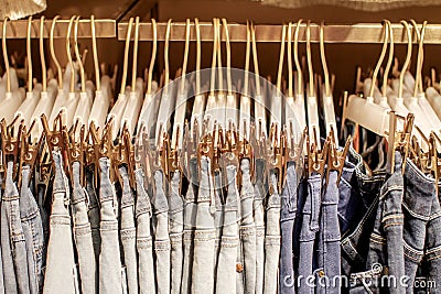 Preview jeans hanging on a hanger in the store Stock Photo