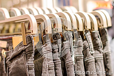 Preview jeans hanging on a hanger in the store Stock Photo