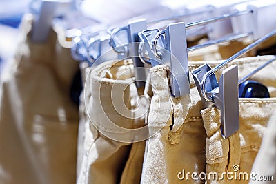 Preview jeans hanging on a hanger in the store Stock Photo