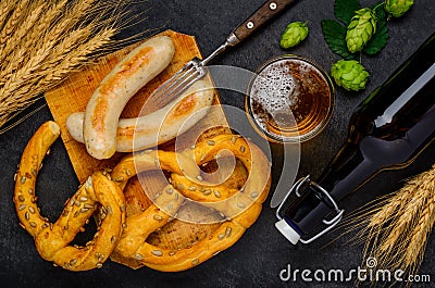 Prezel with Grilled Sausages and Glass Beer Stock Photo