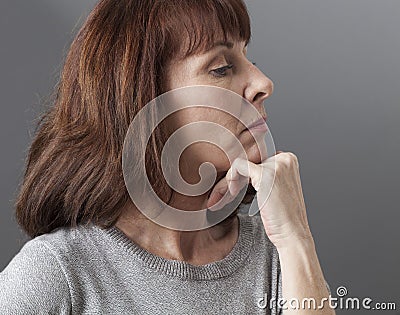 Pride and arrogance for displeased 50s woman Stock Photo