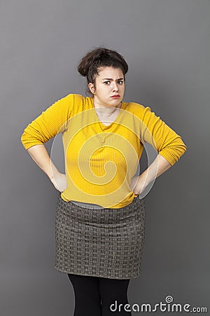 Pride and arrogance for offended big young woman standing up Stock Photo