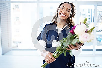 Pride, celebration and portrait of a doctor with flowers at a hospital for promotion and gift for work. Medic, happy and Stock Photo