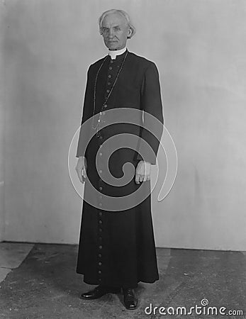 Priest in cassock Stock Photo