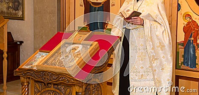 The priest at the christening in the Church Editorial Stock Photo
