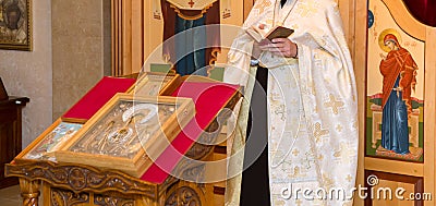 The priest at the christening in the Church Editorial Stock Photo
