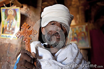 Priest holding a wooden cross, Ethiopia Editorial Stock Photo