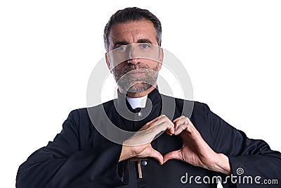 Priest man doing a heart shape with fingers Stock Photo