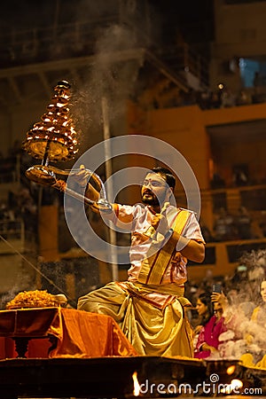 Priest performing ganga aarti at dasaswamedh ghat in varanasi Editorial Stock Photo