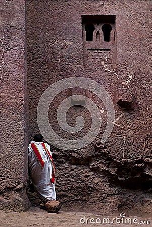 Priest praying outside church in lalibela ethiopia Editorial Stock Photo