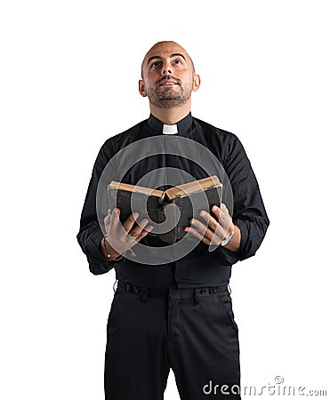 Priest praying Stock Photo