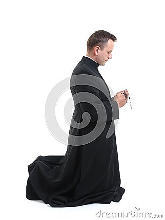 Priest with rosary Stock Photo