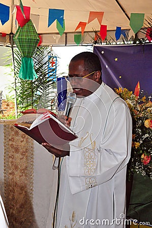 Priest speaking on Festa Junina Editorial Stock Photo
