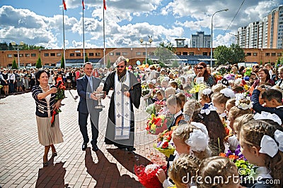 The priest sprinkles the crowd with holy water. Balashikha, Russia. Editorial Stock Photo