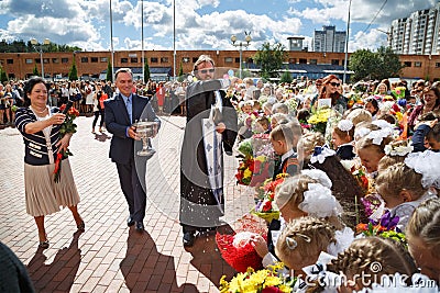 The priest sprinkles the crowd with holy water. Balashikha, Russia. Editorial Stock Photo