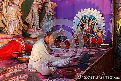 Priest worshiping in Hindu temple Editorial Stock Photo