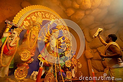 Priest worshipping Goddess Durga, Durga Puja festival celebration Editorial Stock Photo