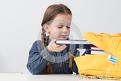 Primary education cute school girl backpack Stock Photo