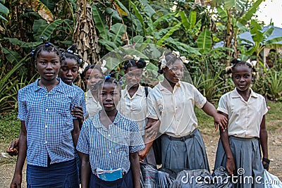 Primary and secondary school children gather in schoolyard to watch missionaries. Editorial Stock Photo