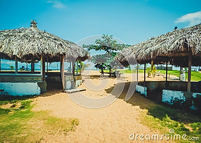 Primitive covered with reeds beach cabanas. Monrovia the capital of Liberia, Africa Stock Photo