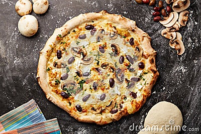 Primo Pizza topping with mushroom and coriander isolated on dark background with raw food top view of italian fastfood appetizer Stock Photo