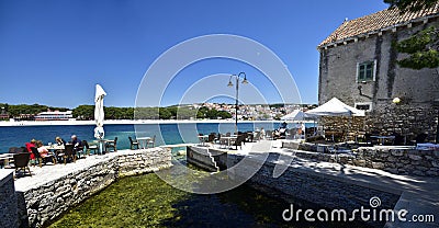 People in superb situated restaurant in beautiful Primosten town in Dalmatia Editorial Stock Photo