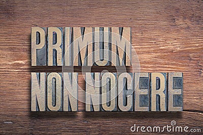 Primum non nocere wood Stock Photo