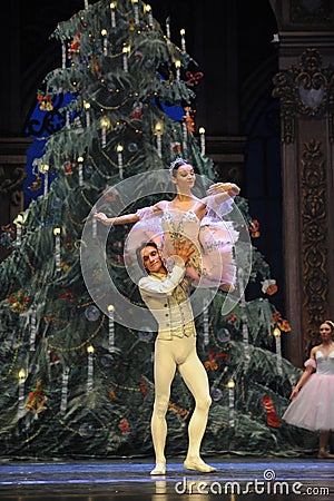 The prince Clara hold up-The Ballet Nutcracker Editorial Stock Photo