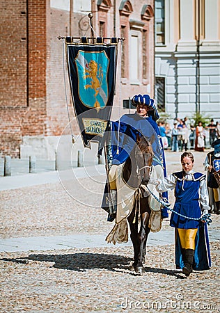 Prince on horseback followed by a squire beautiful woman Editorial Stock Photo