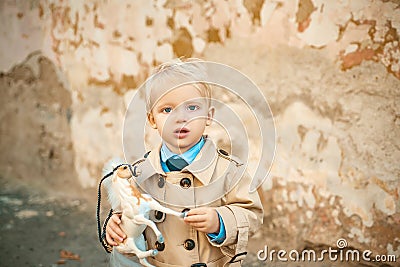 Prince on white horse. small boy prince. small kid with toy horse. happy childhood. childrens day. little boy in vintage Stock Photo