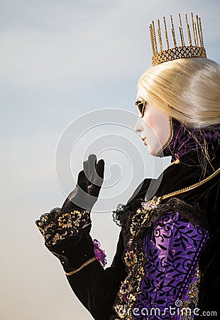 Princess with crown, blondy hair and venetian mask during venice carnival Editorial Stock Photo