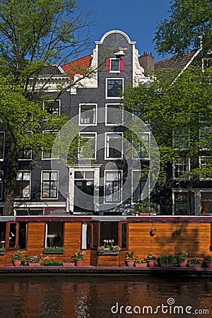 Prinsengracht with houseboat and canal houses Editorial Stock Photo