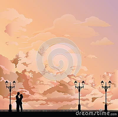 Silhouetted young lovers at dawn Stock Photo