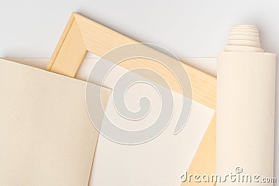 Print photos on canvas, wooden stretcher, canvas roll on white background, top view Stock Photo