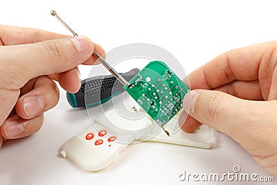 Printed circuit board of security system remote control in man`s Stock Photo