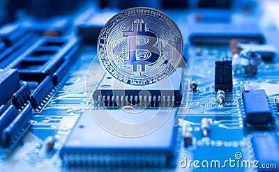 Crypto currency bitcoin on printed circuit board Stock Photo