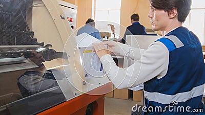 Printing Process on polygraph industry - magazines on the conveyor belt Stock Photo