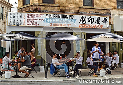 A Printing Shop in Chinatown is Replaced by an American CafÃ© Restaurant Editorial Stock Photo