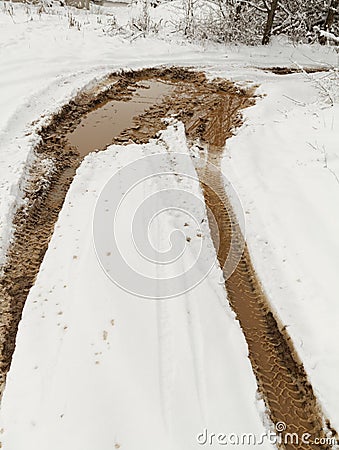 Prints of wheels on a muddy snow Stock Photo