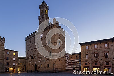 Priori Palace and Square in the evening blue light, Volterra, Pisa, Tuscany, Italy Editorial Stock Photo