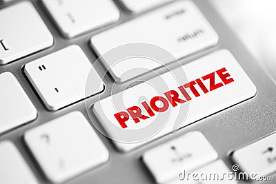 Prioritize - determine the order for dealing with according to their relative importance, text concept button on keyboard Stock Photo