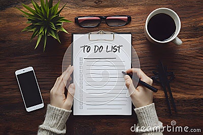 Prioritized to do list fosters productivity in time crunched schedules Stock Photo