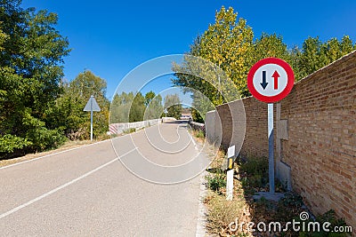 Priority pass signal in narrow rural road Stock Photo