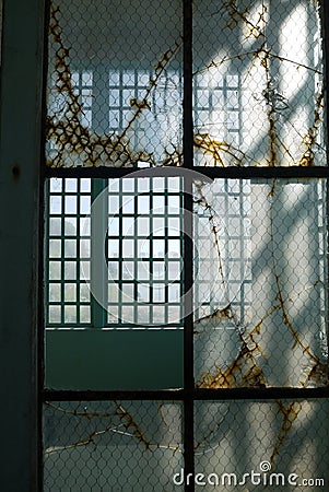 Prison: broken glass steel windows v Stock Photo