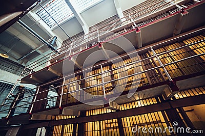 Prison cells in big jail and security guard. Editorial Stock Photo