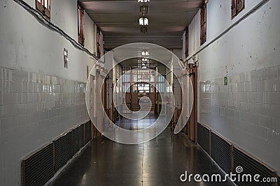 Prison corridor with checkpoint in the end Stock Photo
