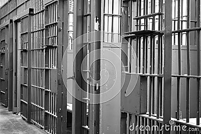 Prison jail cell locked bars Stock Photo