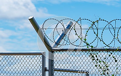 Prison security fence. Barbed wire security fence. Razor wire jail fence. Barrier border. Boundary security wall. Prison for Stock Photo