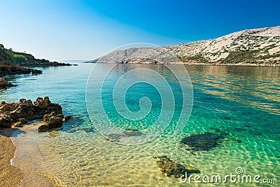 The pristine coastline and crystal clear water of the island of Stock Photo